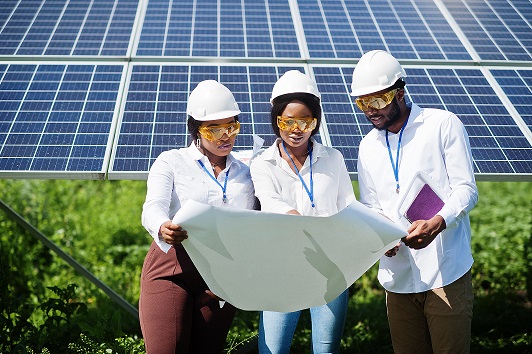 Chris Tech technicians installing a solar inverter
